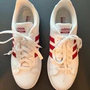 Size 9 women’s white Adidas with maroon stripes